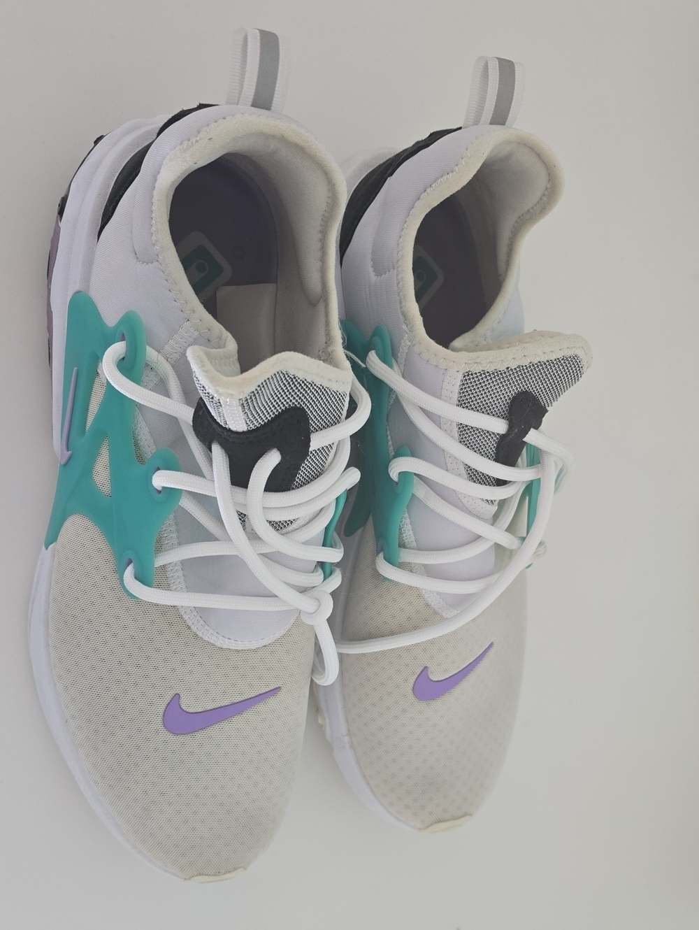 Nike White Sneakers with Teal Cage and Lavender Swoosh